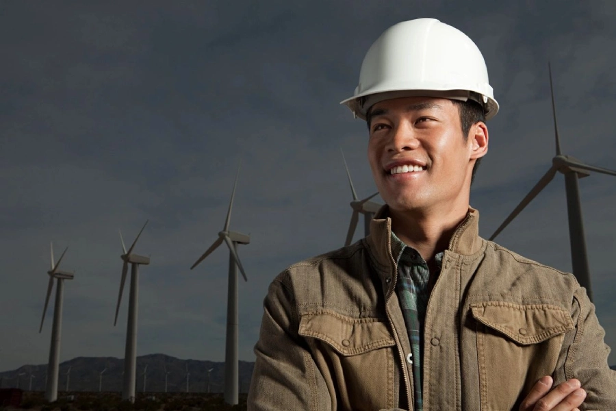 A Man Smiling in a White Color Helmet Image