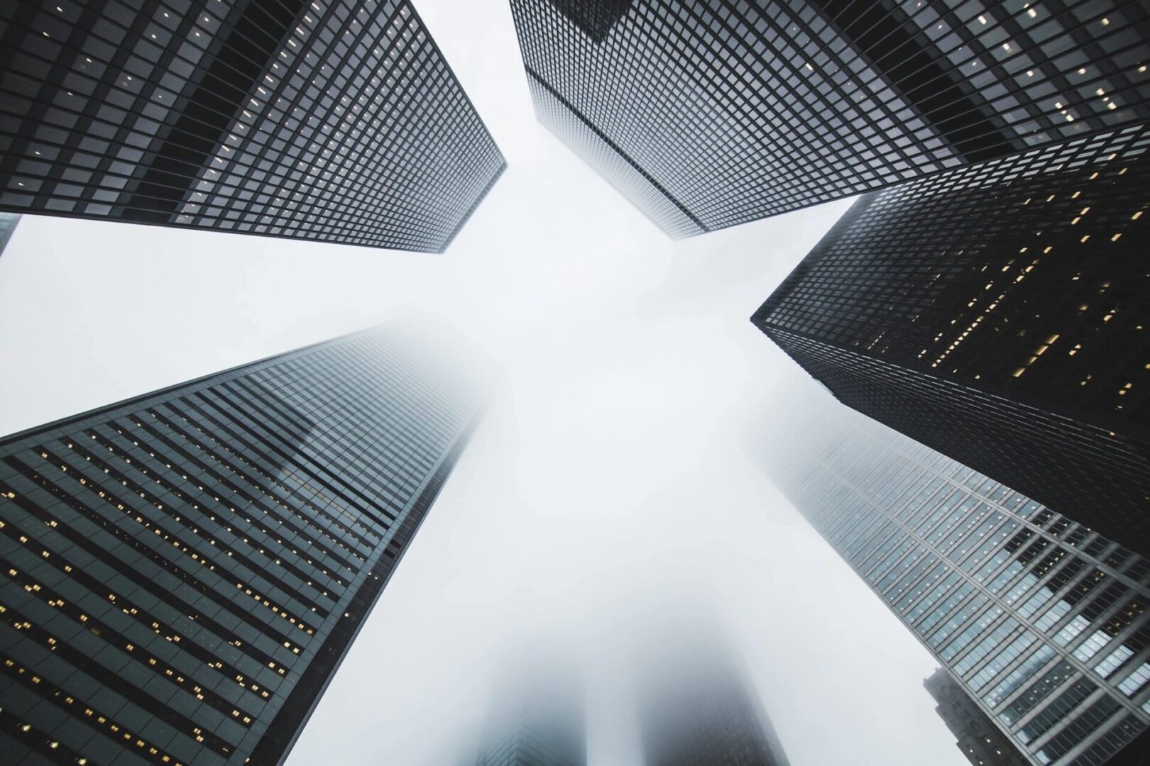 A view of skyscrapers from below looking up.